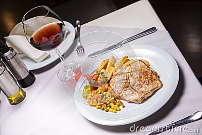 Grilled Pork loin, side dish and Wine Stock Photo